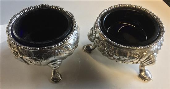 Two silver cauldron salts and a spoon